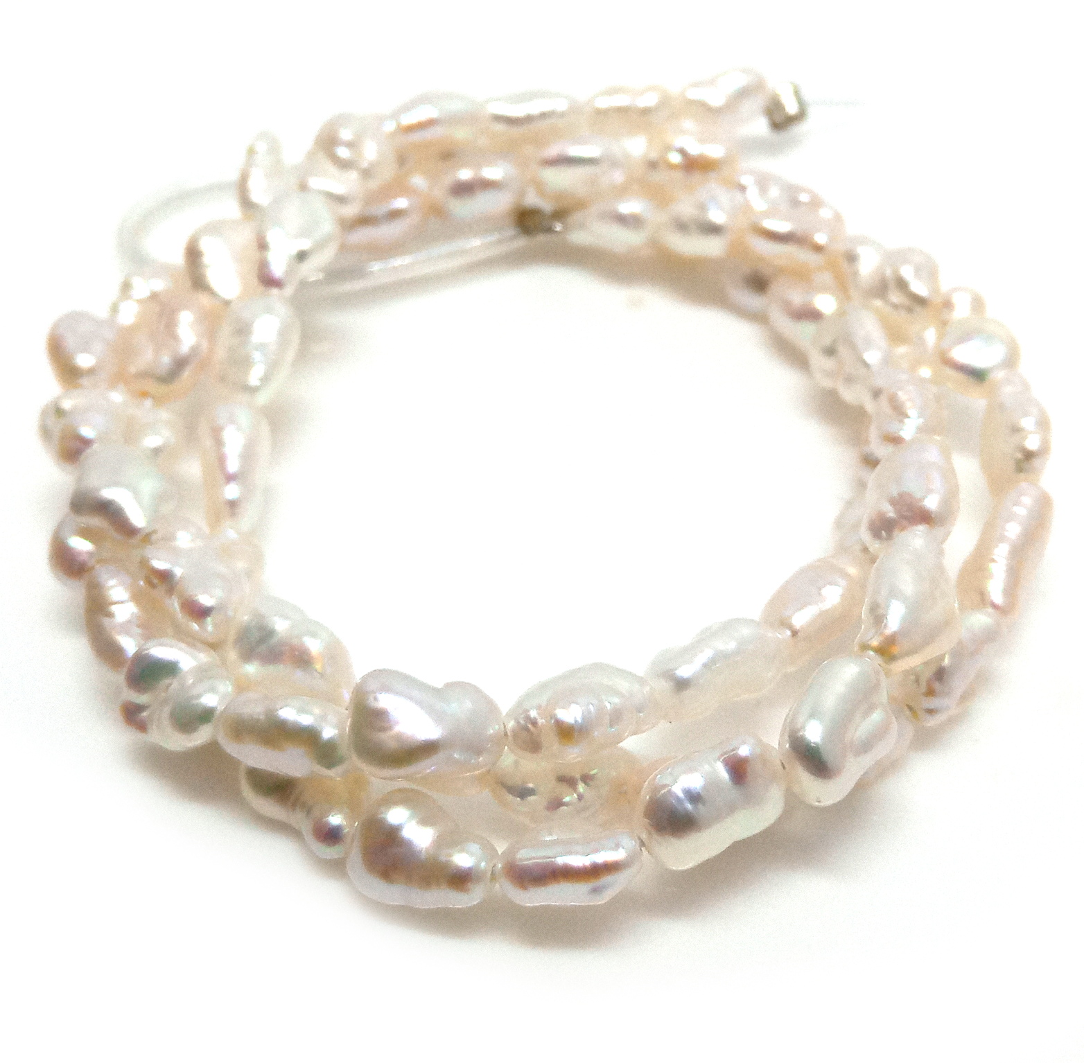 White Small Elliptical Keishi Pearls